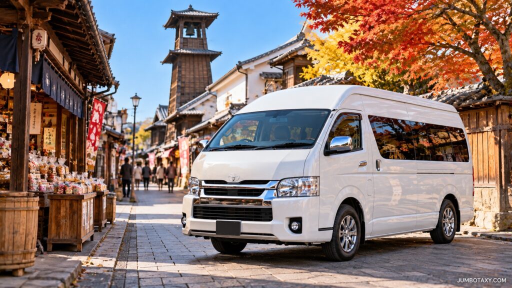 菓子屋横丁に停まる白いジャンボタクシー（ハイエース）